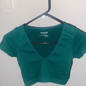 Size XS. V neck short sleeve from Garage